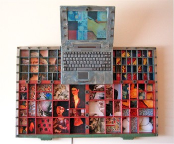 An open laptop rising from a printer’s typecase, its compartments filled with faces and painted details